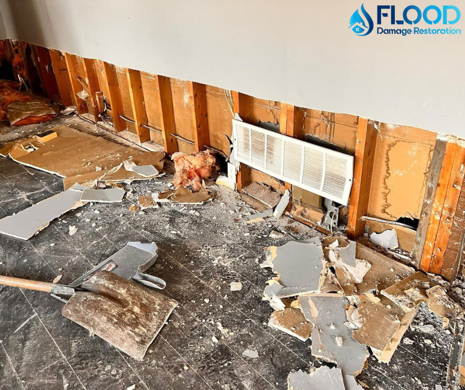 Commercial water damage with drywall removed for structural drying.